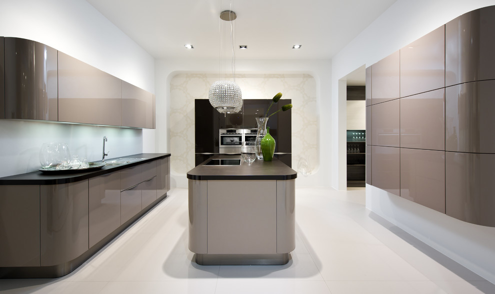 Inspiration for a modern u-shaped eat-in kitchen remodel in Toronto with a drop-in sink, flat-panel cabinets, brown cabinets and stainless steel appliances
