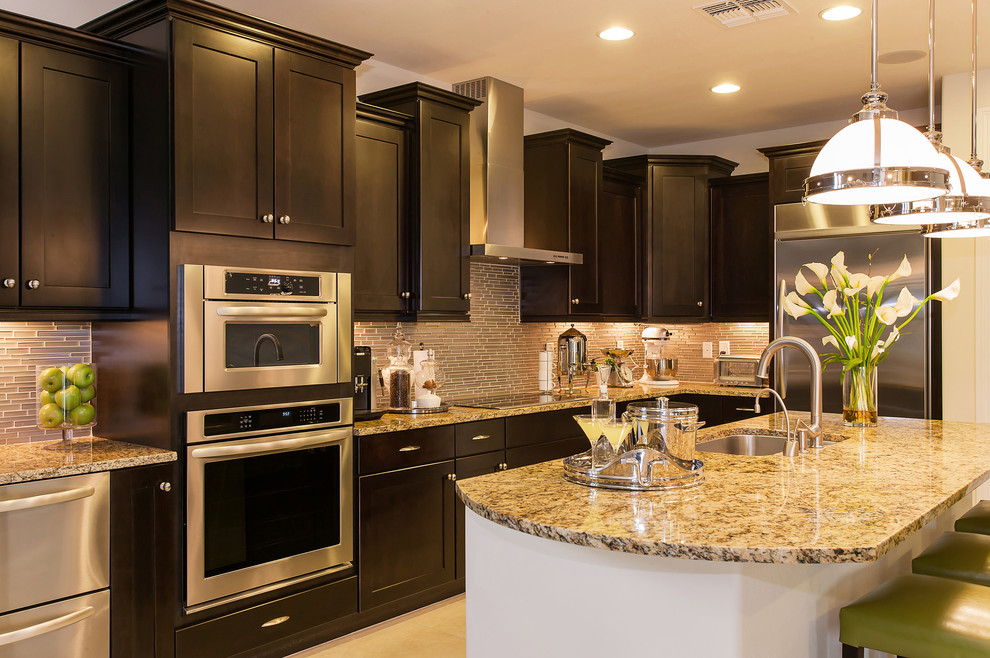 Mid-sized trendy l-shaped beige floor eat-in kitchen photo in Orlando with a single-bowl sink, shaker cabinets, dark wood cabinets, granite countertops, beige backsplash, matchstick tile backsplash, stainless steel appliances and an island