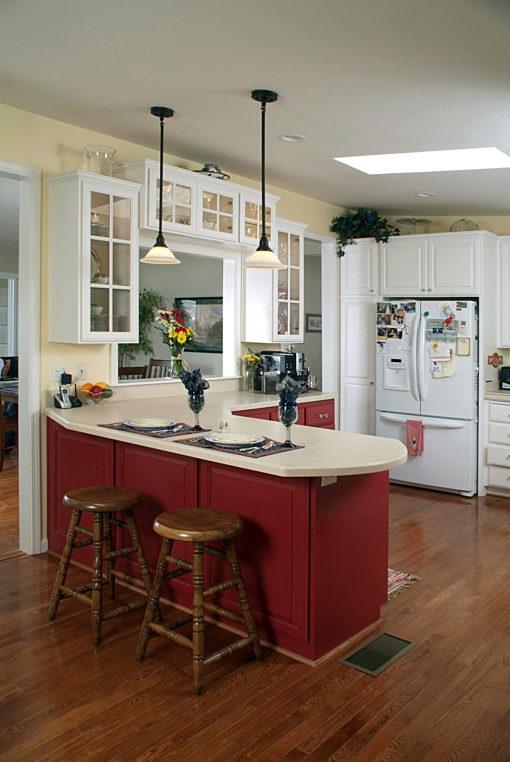 GE Profile #kitchen with red walls, white #cabinets and white