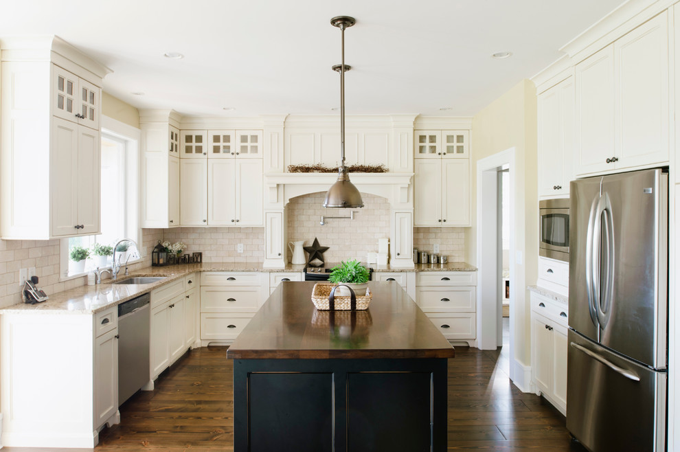 Design ideas for a traditional u-shaped kitchen in Vancouver with wood worktops.