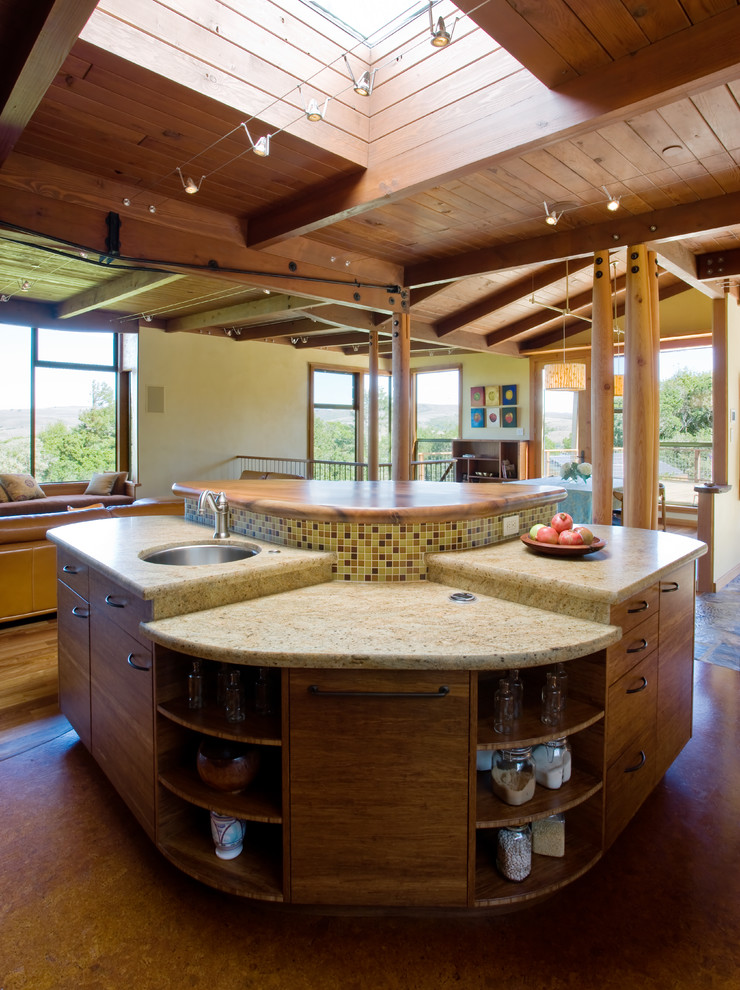 Example of a mid-sized mountain style cork floor open concept kitchen design in San Francisco with an undermount sink, flat-panel cabinets, medium tone wood cabinets, quartz countertops, multicolored backsplash, glass tile backsplash and an island