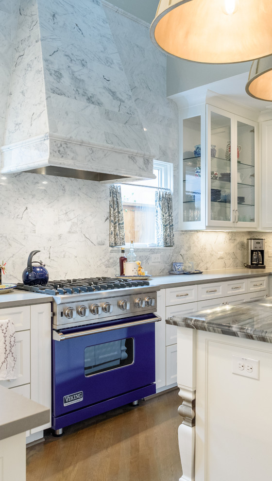 Inspiration for a timeless light wood floor kitchen remodel in Dallas with recessed-panel cabinets, white cabinets, gray backsplash, colored appliances and an island