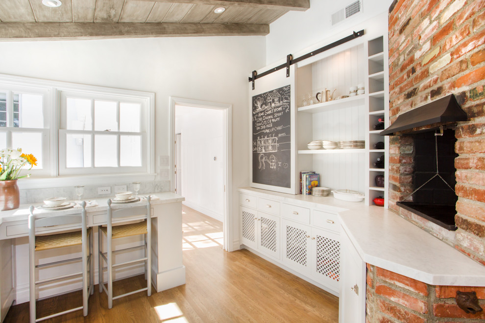 Inspiration for a timeless kitchen remodel in Los Angeles with open cabinets and white cabinets