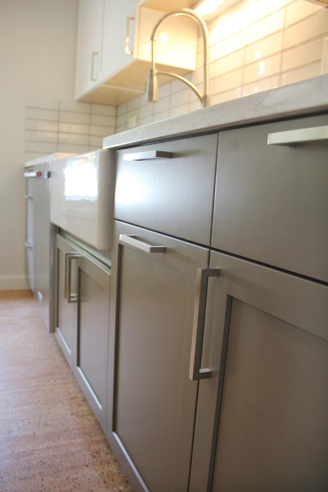 Eat-in kitchen - small modern galley medium tone wood floor and brown floor eat-in kitchen idea in Portland with an undermount sink, shaker cabinets, white cabinets, marble countertops, white backsplash, subway tile backsplash, stainless steel appliances and no island