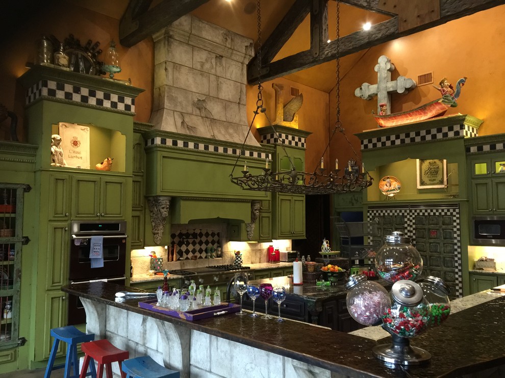 This is an example of a large eclectic kitchen/diner in Austin with a double-bowl sink, raised-panel cabinets, green cabinets, copper worktops, white splashback, cement tile splashback, stainless steel appliances, concrete flooring and an island.