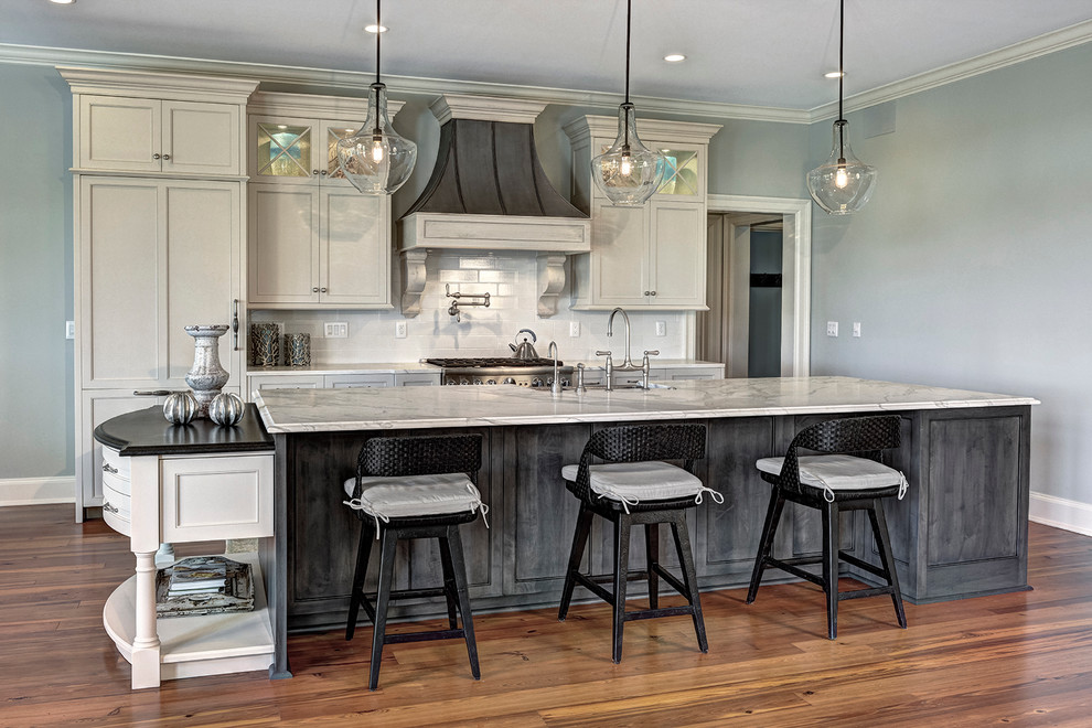 Inspiration for a classic galley kitchen in Charleston with recessed-panel cabinets, white cabinets, white splashback, metro tiled splashback, stainless steel appliances and marble worktops.