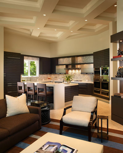 Example of a small trendy l-shaped open concept kitchen design in Miami with dark wood cabinets and an island