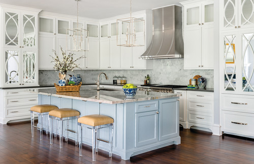 Transitional kitchen featuring natural stone countertops