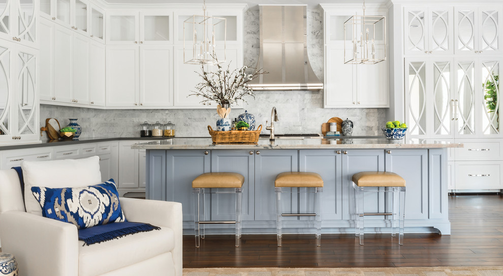 Inspiration for a large transitional l-shaped dark wood floor and brown floor open concept kitchen remodel in Houston with white cabinets, white backsplash, an island, gray countertops, an undermount sink, recessed-panel cabinets and marble backsplash