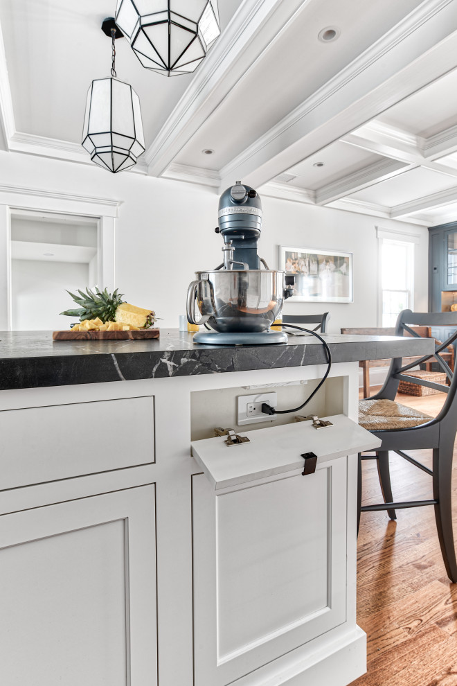 Large elegant l-shaped medium tone wood floor and brown floor eat-in kitchen photo in New York with an undermount sink, shaker cabinets, white cabinets, marble countertops, white backsplash, subway tile backsplash, paneled appliances, an island and white countertops