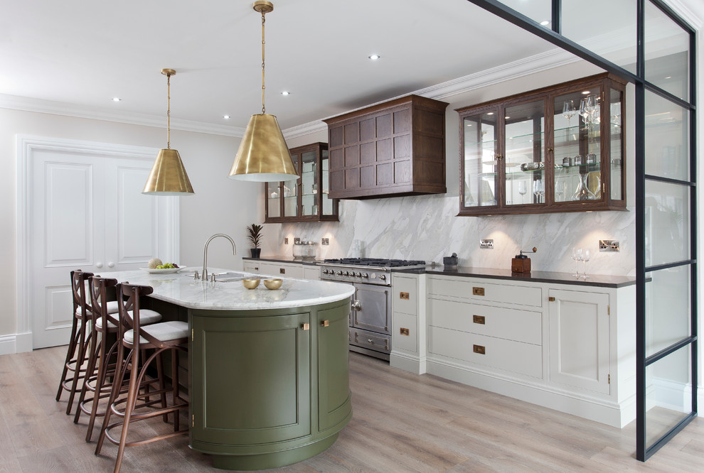 Transitional galley light wood floor kitchen photo in Dublin with an undermount sink, beaded inset cabinets, marble countertops, stainless steel appliances and an island