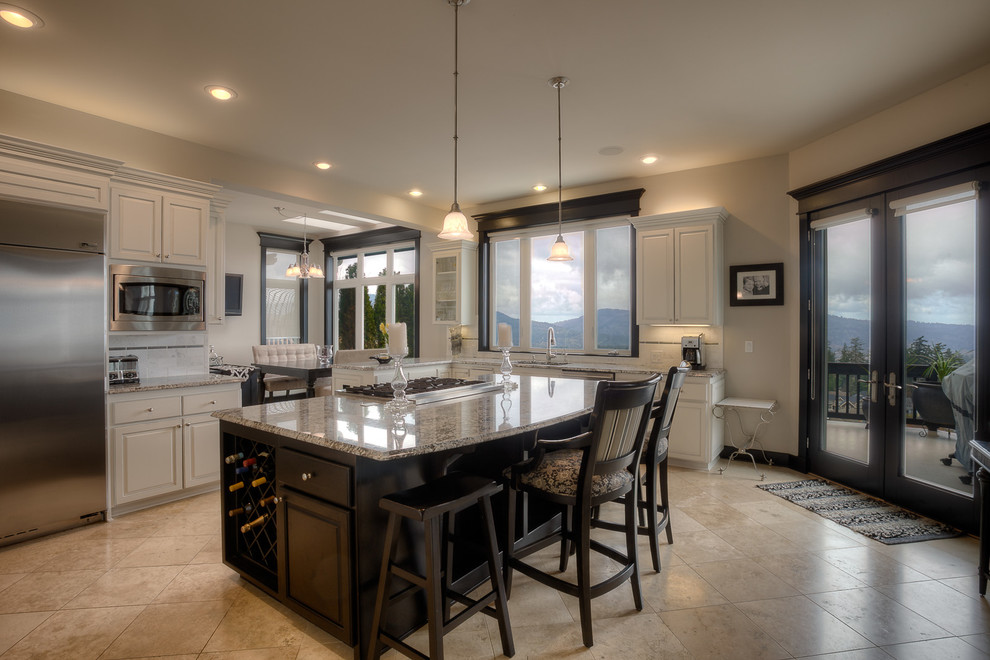 Example of a mid-sized classic galley marble floor eat-in kitchen design in Seattle with an undermount sink, granite countertops, stainless steel appliances, an island, raised-panel cabinets, light wood cabinets, metallic backsplash and window backsplash