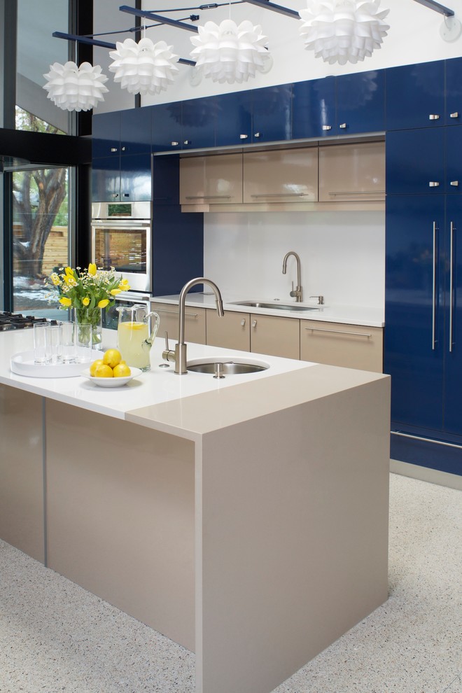 Kitchen - contemporary kitchen idea in Denver with an undermount sink, flat-panel cabinets, blue cabinets, white backsplash, stainless steel appliances and an island