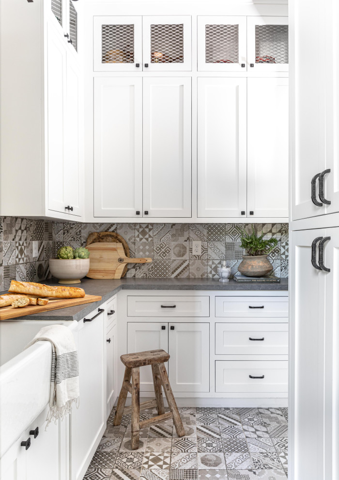 Kitchen pantry - large cottage u-shaped vinyl floor, brown floor and exposed beam kitchen pantry idea in Sacramento with a drop-in sink, shaker cabinets, white cabinets, quartz countertops, brown backsplash, brick backsplash, stainless steel appliances, an island and gray countertops