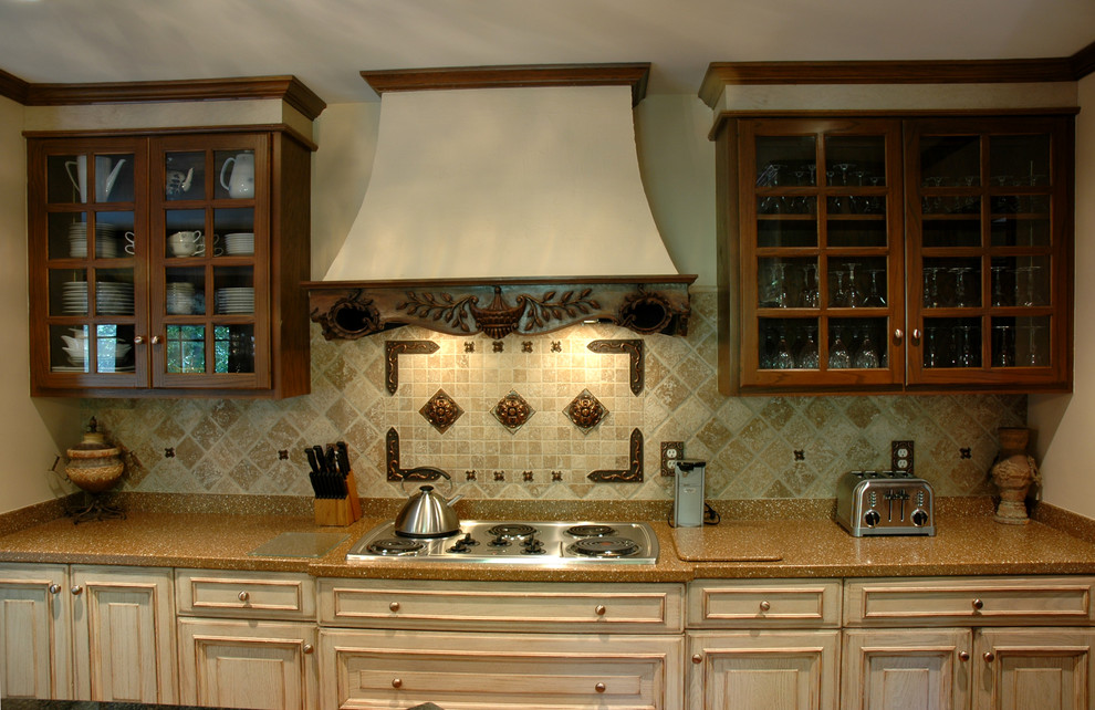 Inspiration for a mediterranean u-shaped medium tone wood floor eat-in kitchen remodel in Indianapolis with an undermount sink, raised-panel cabinets, beige cabinets, stainless steel appliances and an island