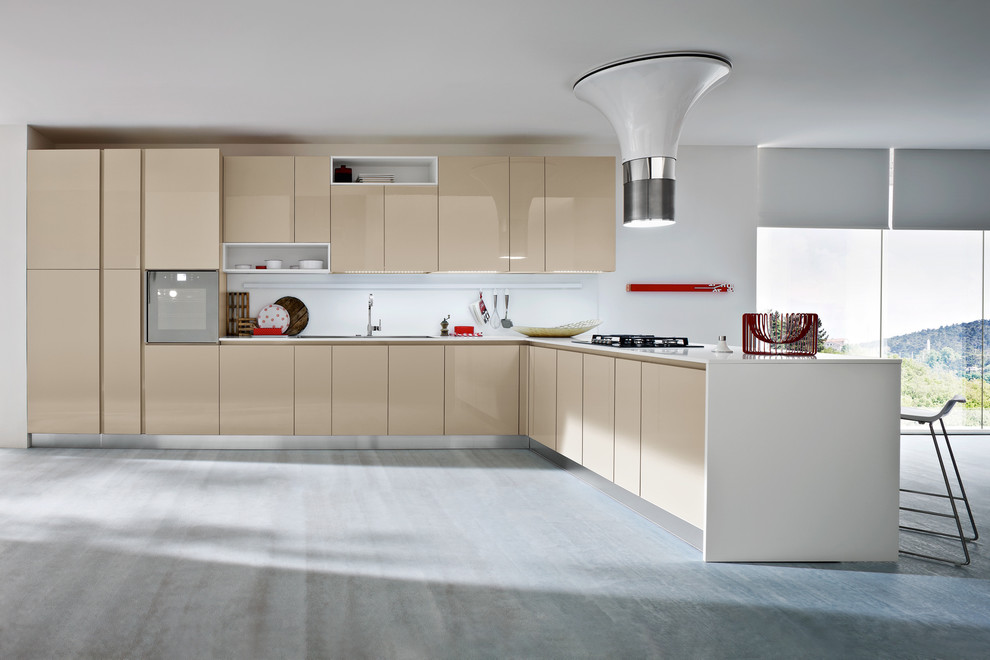 Eat-in kitchen - mid-sized contemporary l-shaped eat-in kitchen idea in New York with a drop-in sink, flat-panel cabinets, beige cabinets, white backsplash and no island