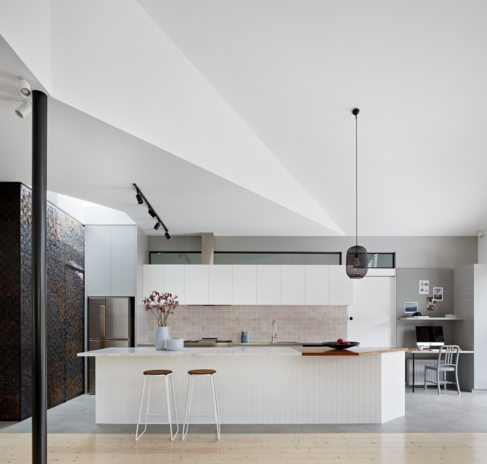 Inspiration for a medium sized contemporary galley kitchen/diner in Melbourne with white cabinets, marble worktops, red splashback, ceramic splashback, stainless steel appliances, an island and white worktops.