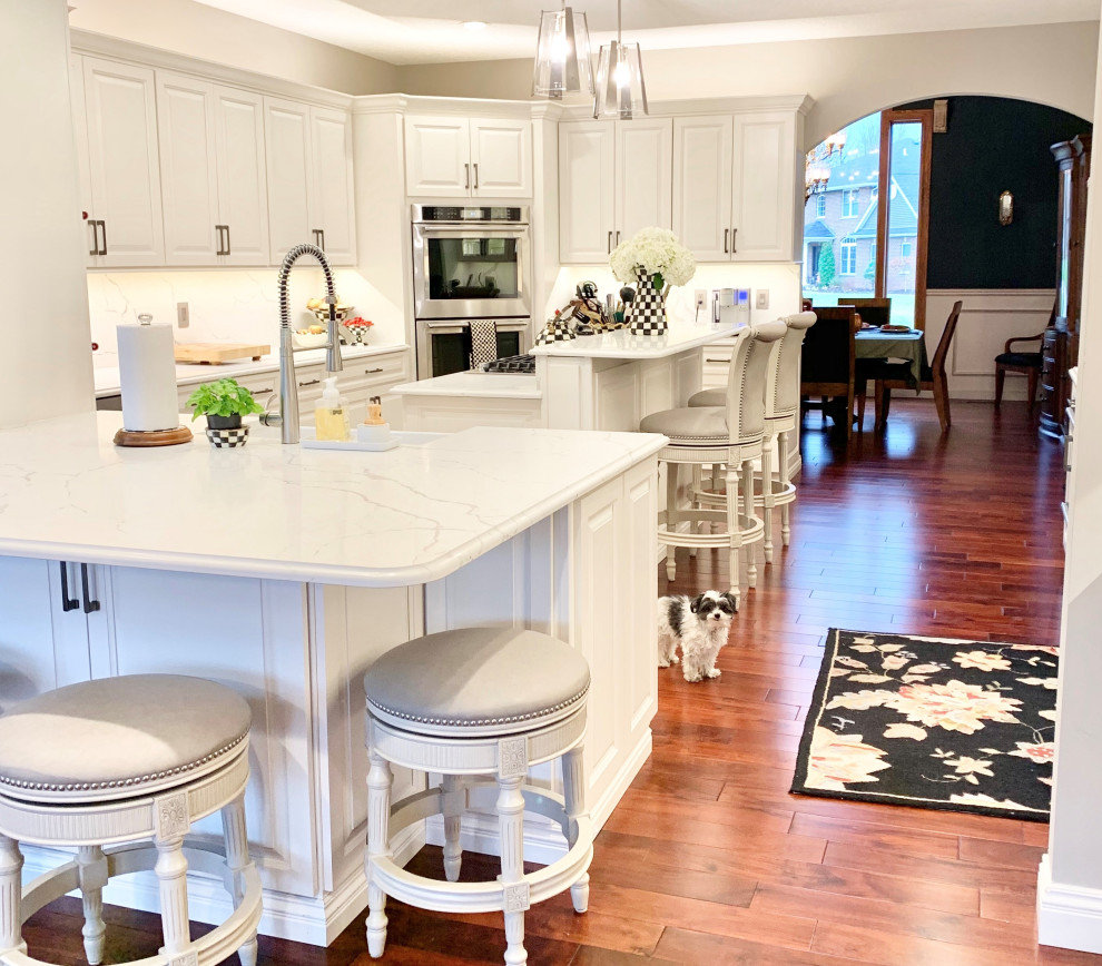 Ivory White Kitchen With Marble Look Quartz Counters and Splash