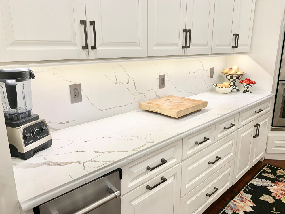 Ivory White Kitchen With Marble Look Quartz Counters and Splash