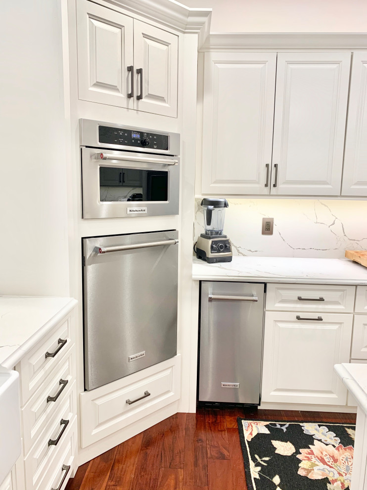 Ivory White Kitchen With Marble Look Quartz Counters and Splash