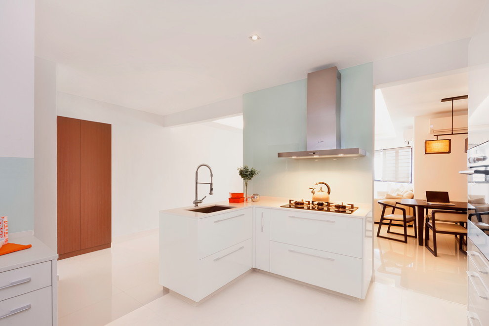 Mid-sized trendy l-shaped eat-in kitchen photo in Singapore with no island, an undermount sink and stainless steel appliances