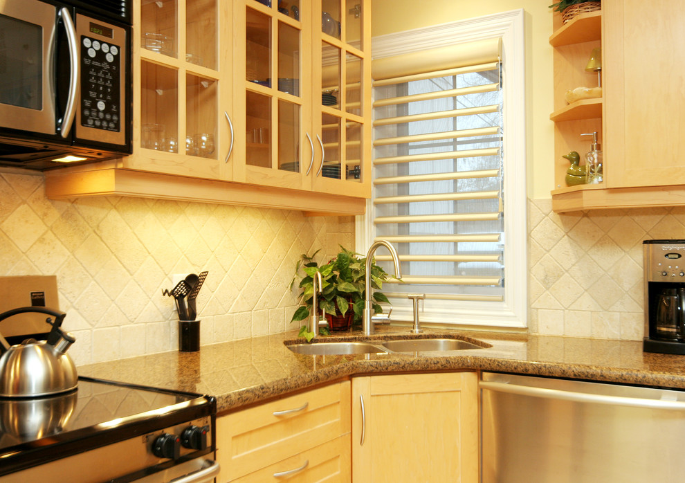 Mid-sized trendy l-shaped eat-in kitchen photo in Toronto with a double-bowl sink, beige backsplash, stainless steel appliances, shaker cabinets, light wood cabinets, granite countertops, stone tile backsplash and an island