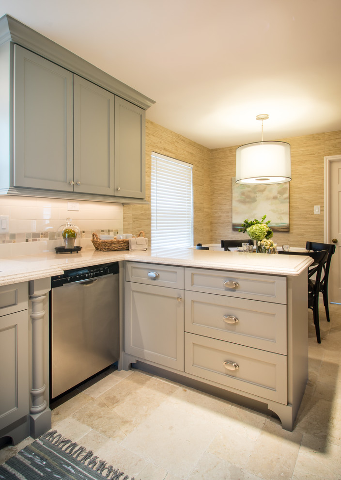 This is an example of a medium sized traditional u-shaped kitchen/diner in Houston with a submerged sink, shaker cabinets, grey cabinets, engineered stone countertops, yellow splashback, ceramic splashback, stainless steel appliances, marble flooring and a breakfast bar.