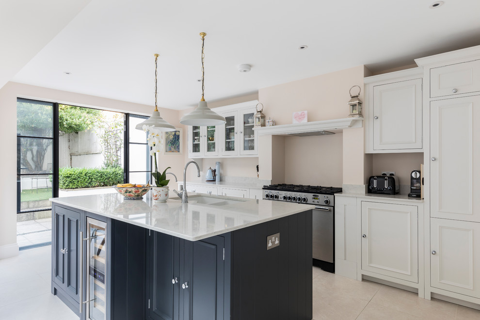 Example of a transitional kitchen design in London
