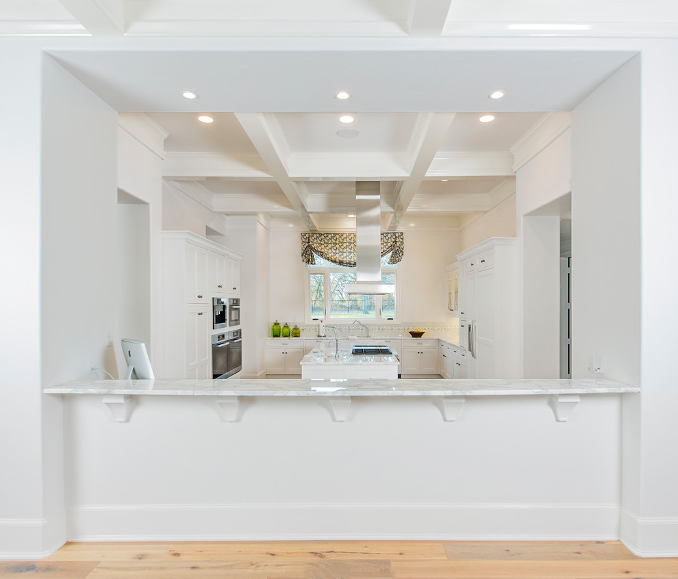 Open concept kitchen - large contemporary u-shaped medium tone wood floor open concept kitchen idea in Dallas with an undermount sink, shaker cabinets, white cabinets, marble countertops, white backsplash and stainless steel appliances