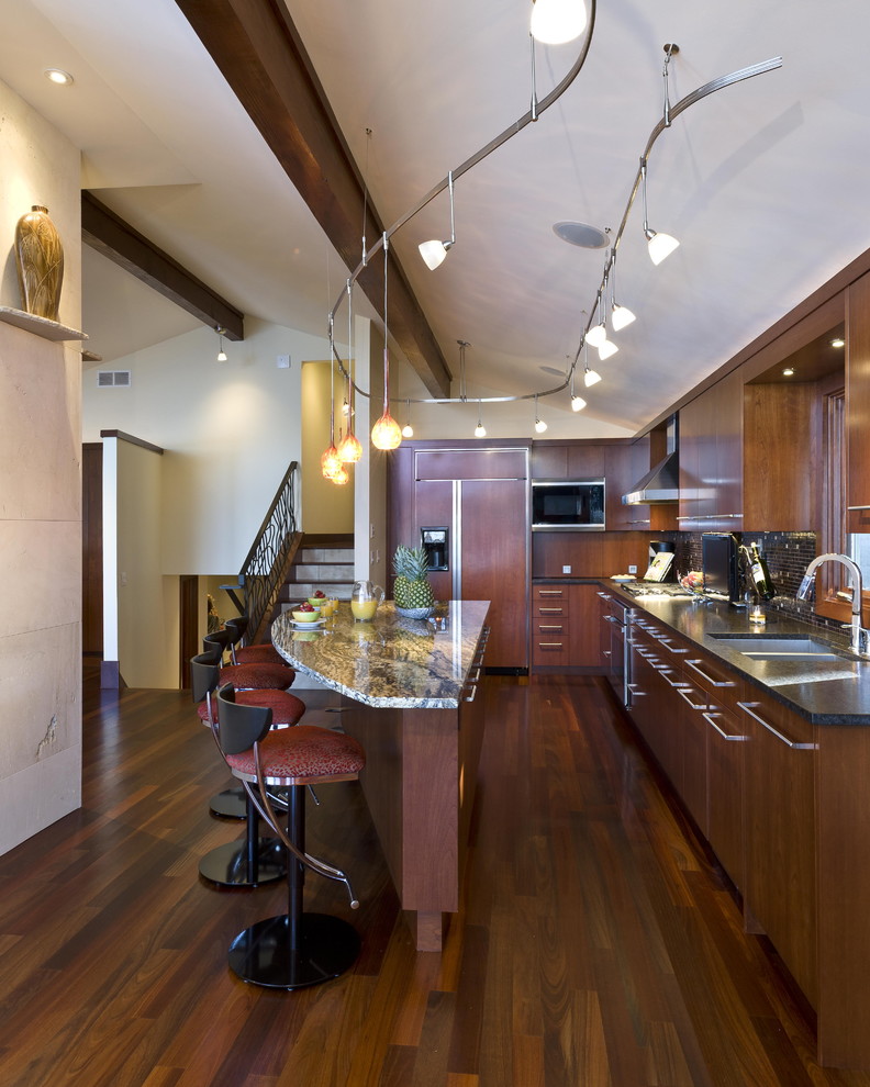 Trendy kitchen photo in Minneapolis with a double-bowl sink, dark wood cabinets and paneled appliances