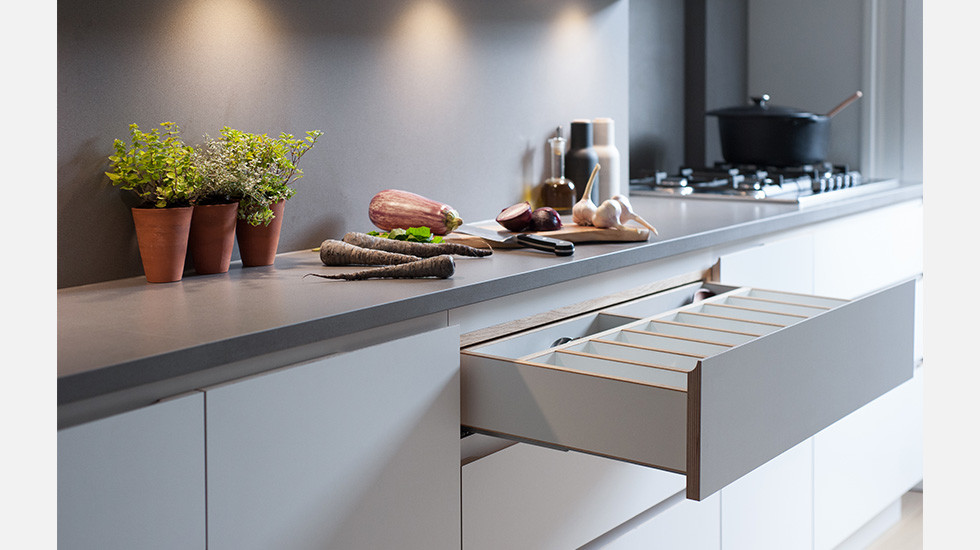 Photo of a contemporary galley kitchen in London.