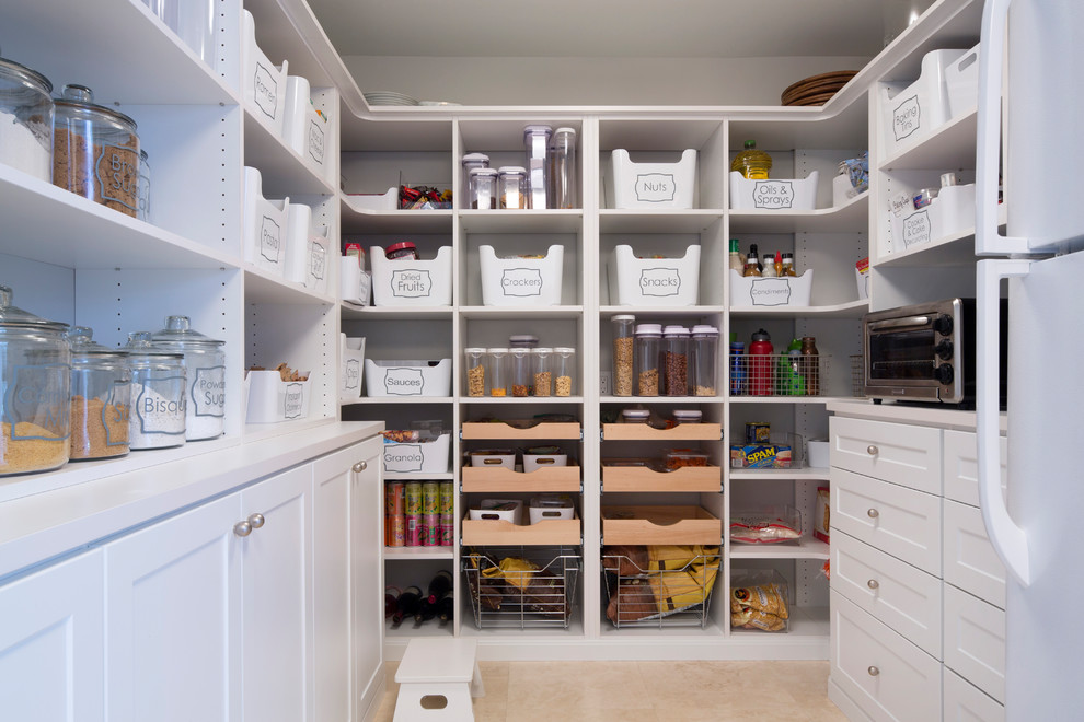 Photo of a traditional kitchen pantry in Hawaii with shaker cabinets, white cabinets, porcelain flooring and beige floors.