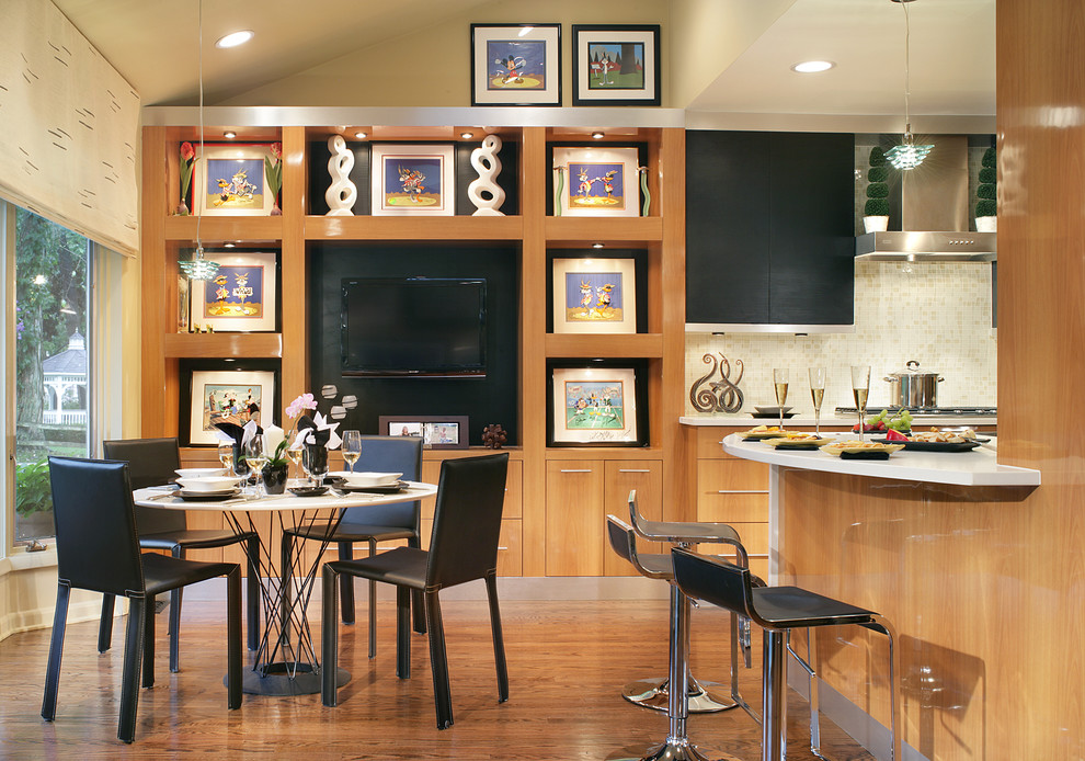 Example of a trendy eat-in kitchen design in New York with flat-panel cabinets, light wood cabinets and beige backsplash