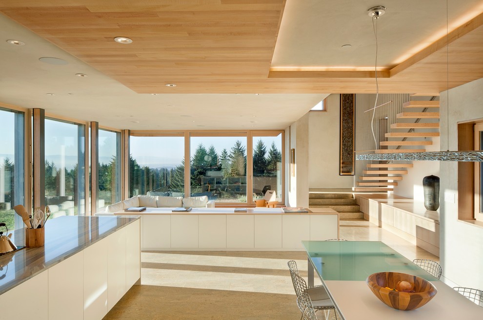 Design ideas for a contemporary kitchen in Portland with flat-panel cabinets and white cabinets.