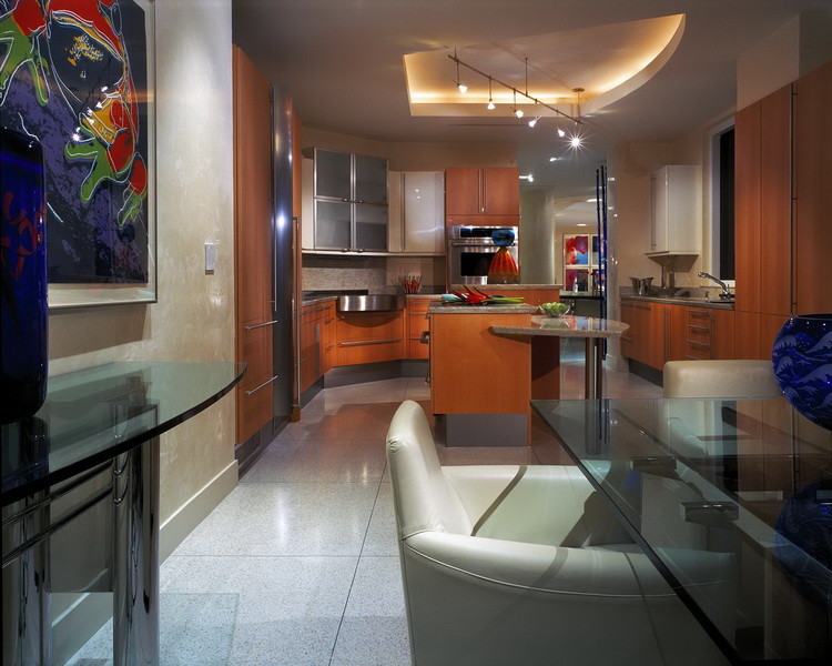 Mid-sized trendy u-shaped eat-in kitchen photo in Miami with an integrated sink, flat-panel cabinets, light wood cabinets, stainless steel appliances and two islands