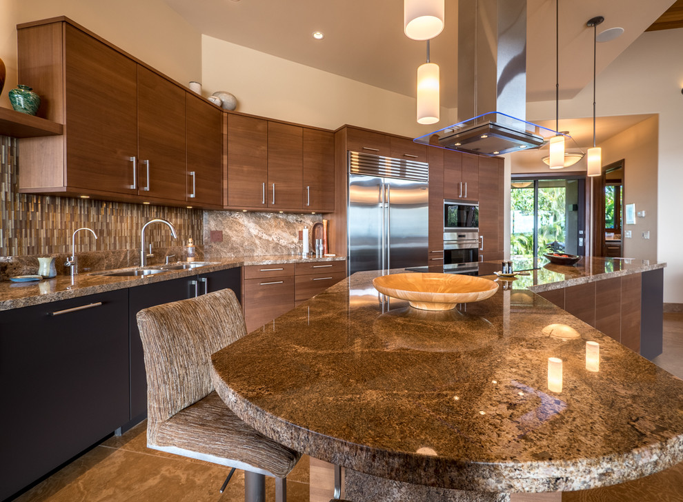 Inspiration for a large world-inspired single-wall open plan kitchen in Hawaii with a submerged sink, flat-panel cabinets, brown cabinets, granite worktops, multi-coloured splashback, glass tiled splashback, stainless steel appliances, limestone flooring, an island, beige floors and multicoloured worktops.
