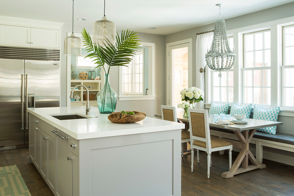 Beach style eat-in kitchen photo in Minneapolis with shaker cabinets, gray cabinets and stainless steel appliances
