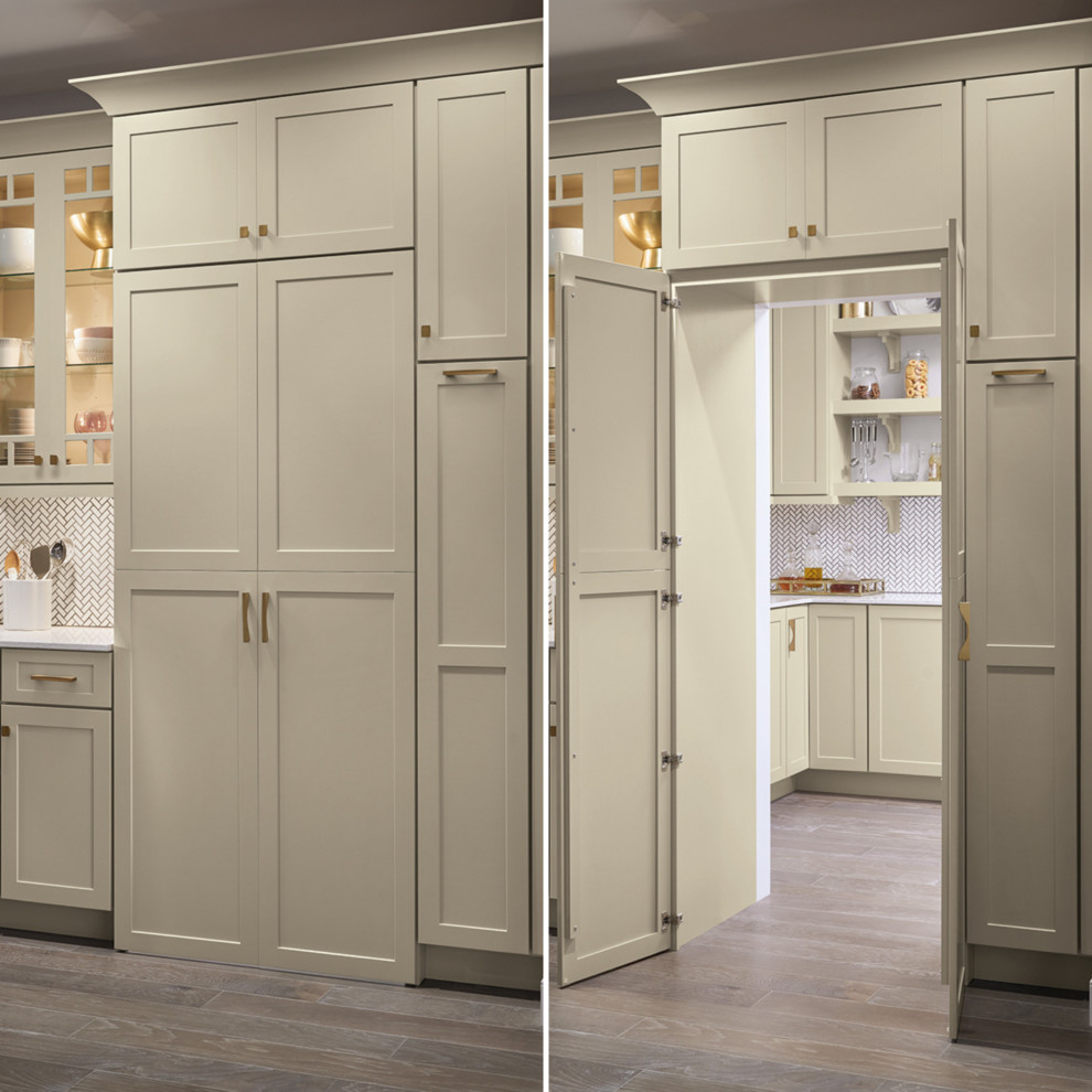 Design ideas for a large traditional l-shaped kitchen pantry in Other with a submerged sink, shaker cabinets, white cabinets, white splashback, stainless steel appliances, dark hardwood flooring, an island, brown floors and white worktops.
