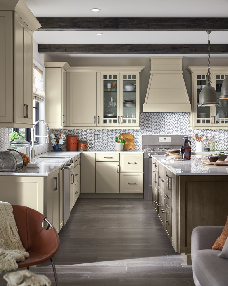 Eat-in kitchen - large transitional l-shaped dark wood floor and brown floor eat-in kitchen idea in Other with an undermount sink, shaker cabinets, white cabinets, white backsplash, stainless steel appliances, an island and white countertops