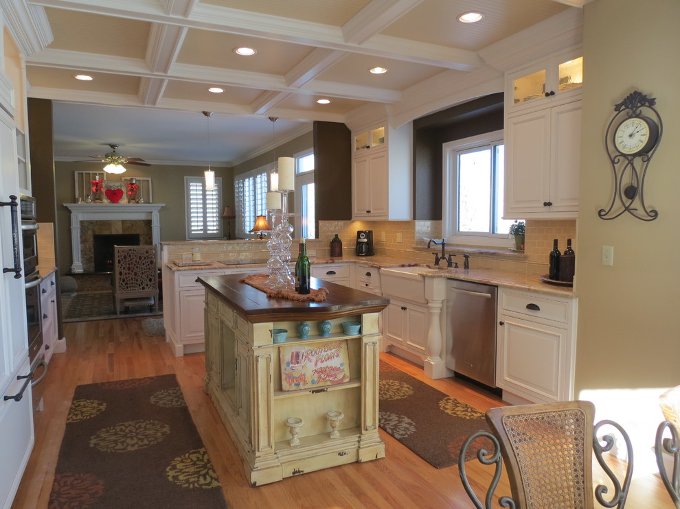 Kitchen - traditional medium tone wood floor kitchen idea in Denver with a single-bowl sink, beaded inset cabinets, white cabinets, granite countertops and subway tile backsplash