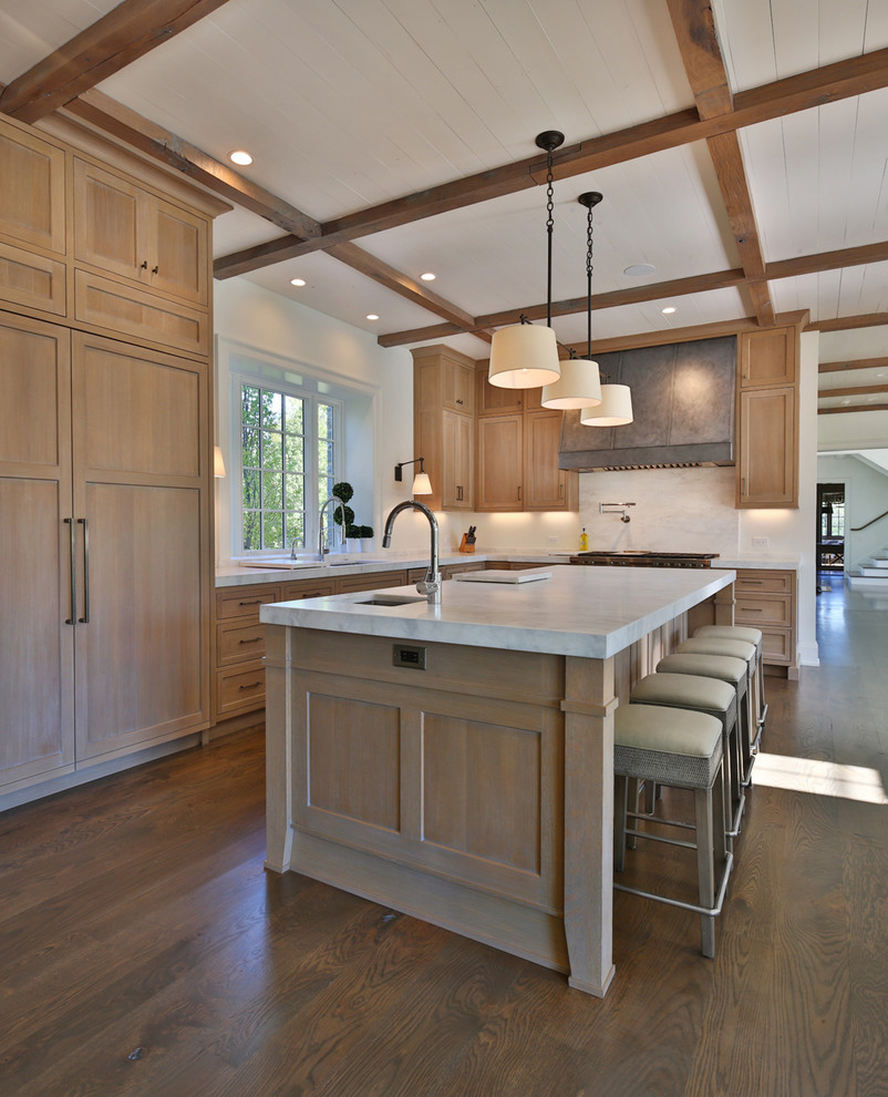 Example of a large transitional l-shaped dark wood floor open concept kitchen design in Columbus with an undermount sink, flat-panel cabinets, light wood cabinets, marble countertops, white backsplash, marble backsplash, paneled appliances, an island and white countertops