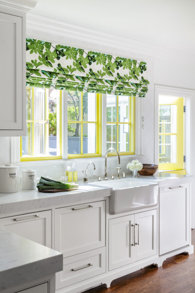 Large elegant dark wood floor, brown floor and coffered ceiling kitchen photo in San Francisco with a farmhouse sink, shaker cabinets, white cabinets, white backsplash, subway tile backsplash, paneled appliances and white countertops