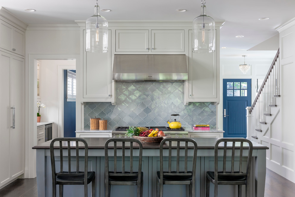 Elegant kitchen photo in Minneapolis with shaker cabinets, white cabinets and blue backsplash