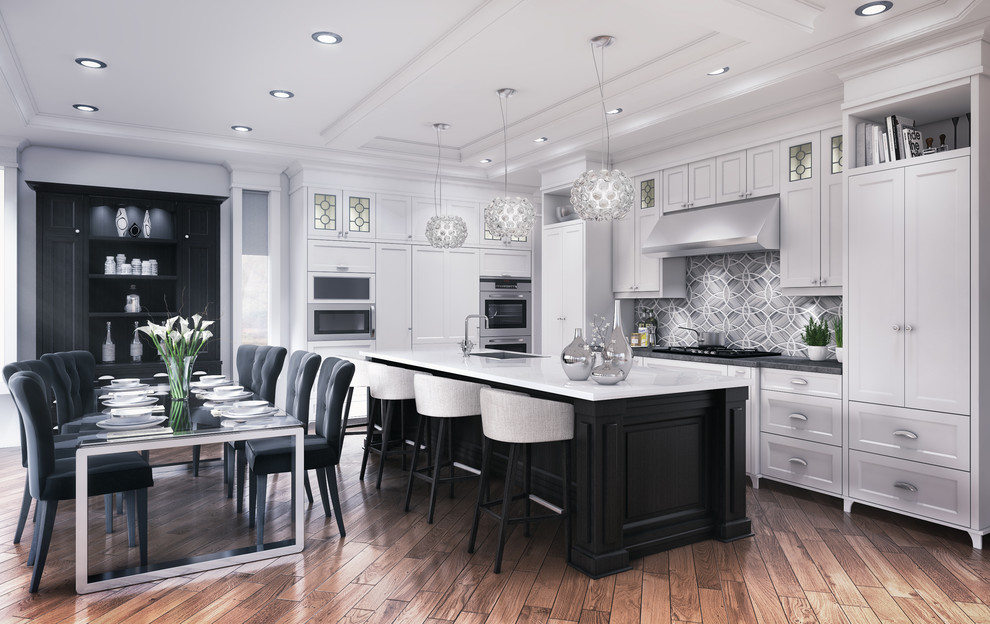 This is an example of a large classic single-wall kitchen/diner in Vancouver with a submerged sink, shaker cabinets, white cabinets, grey splashback, ceramic splashback, stainless steel appliances, medium hardwood flooring, an island and brown floors.