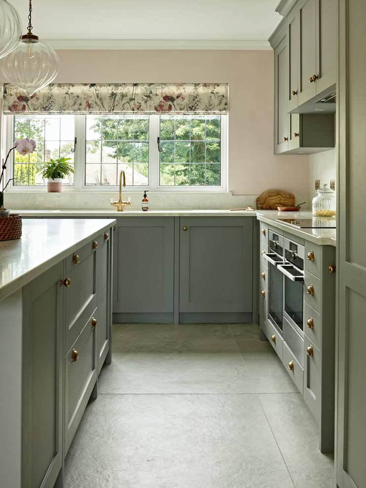 Photo of a medium sized country l-shaped enclosed kitchen in Surrey.