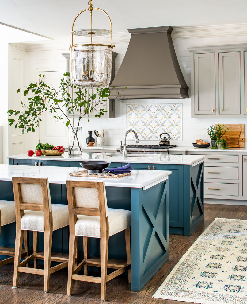 Inspiration for a country galley medium tone wood floor and brown floor kitchen remodel in Atlanta with an undermount sink, recessed-panel cabinets, turquoise cabinets, white backsplash, subway tile backsplash, stainless steel appliances, two islands and white countertops