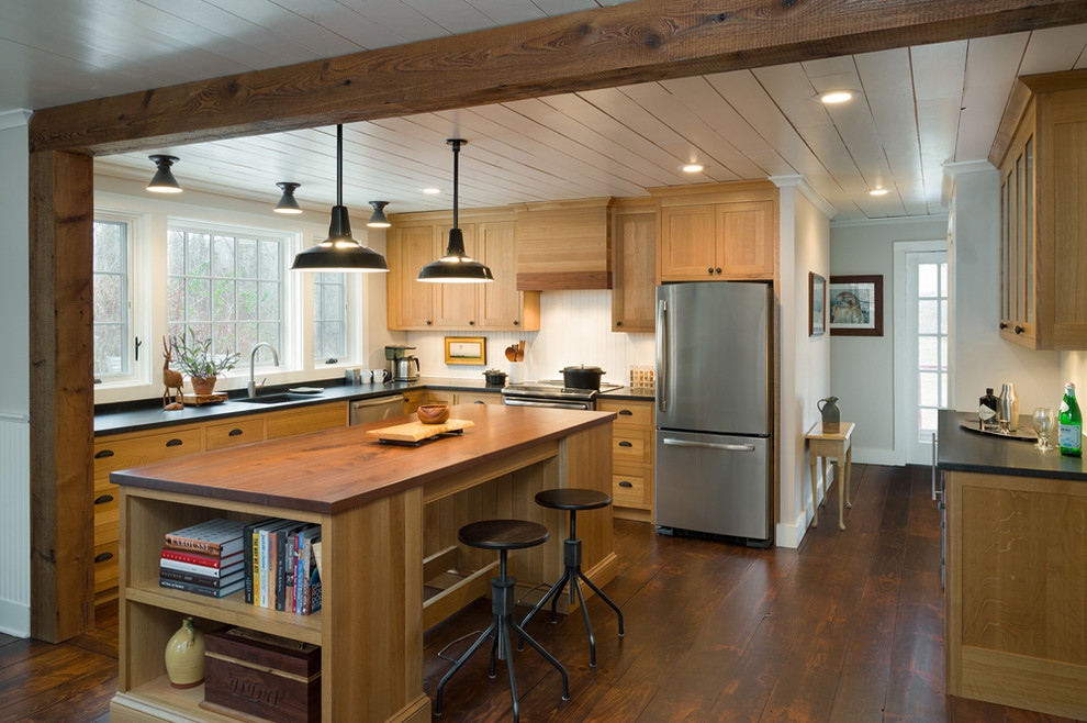 Eat-in kitchen - mid-sized craftsman l-shaped dark wood floor eat-in kitchen idea in Philadelphia with an undermount sink, recessed-panel cabinets, light wood cabinets, granite countertops, white backsplash, stainless steel appliances and an island