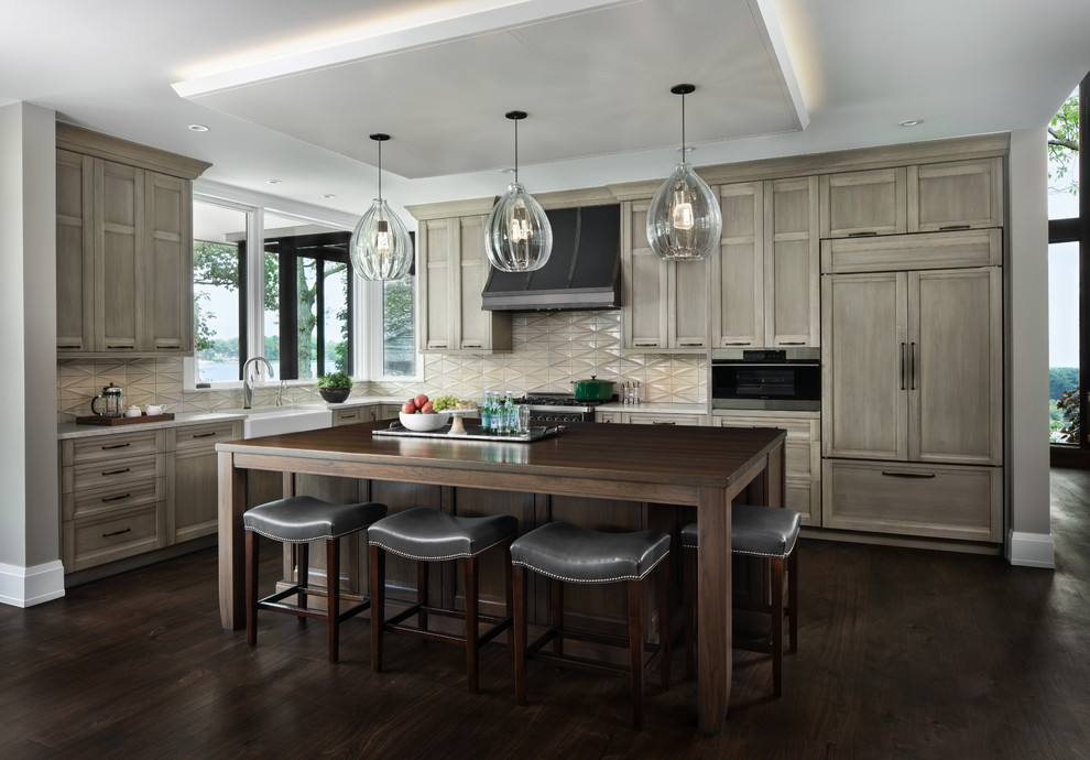 Kitchen - transitional l-shaped dark wood floor and brown floor kitchen idea in Detroit with a farmhouse sink, recessed-panel cabinets, medium tone wood cabinets, wood countertops, beige backsplash, paneled appliances, an island and brown countertops