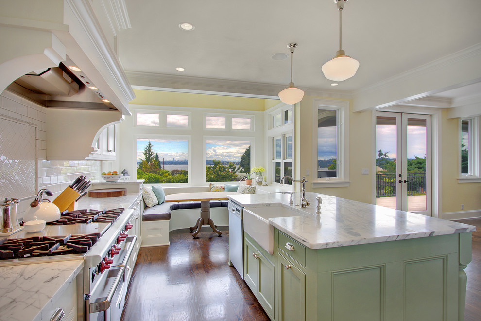 Inspiration for a timeless kitchen remodel in Seattle with subway tile backsplash, a farmhouse sink and green cabinets