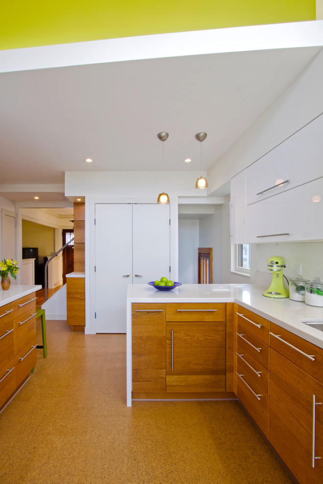 Example of a trendy kitchen design in Minneapolis with an undermount sink, flat-panel cabinets and medium tone wood cabinets
